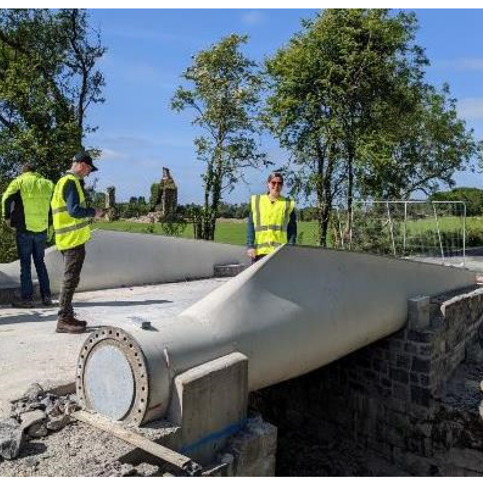 Repurposing wind turbine blades for bridge construction