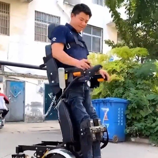 Novel standing electric wheelchair follows user to aid transitioning ...