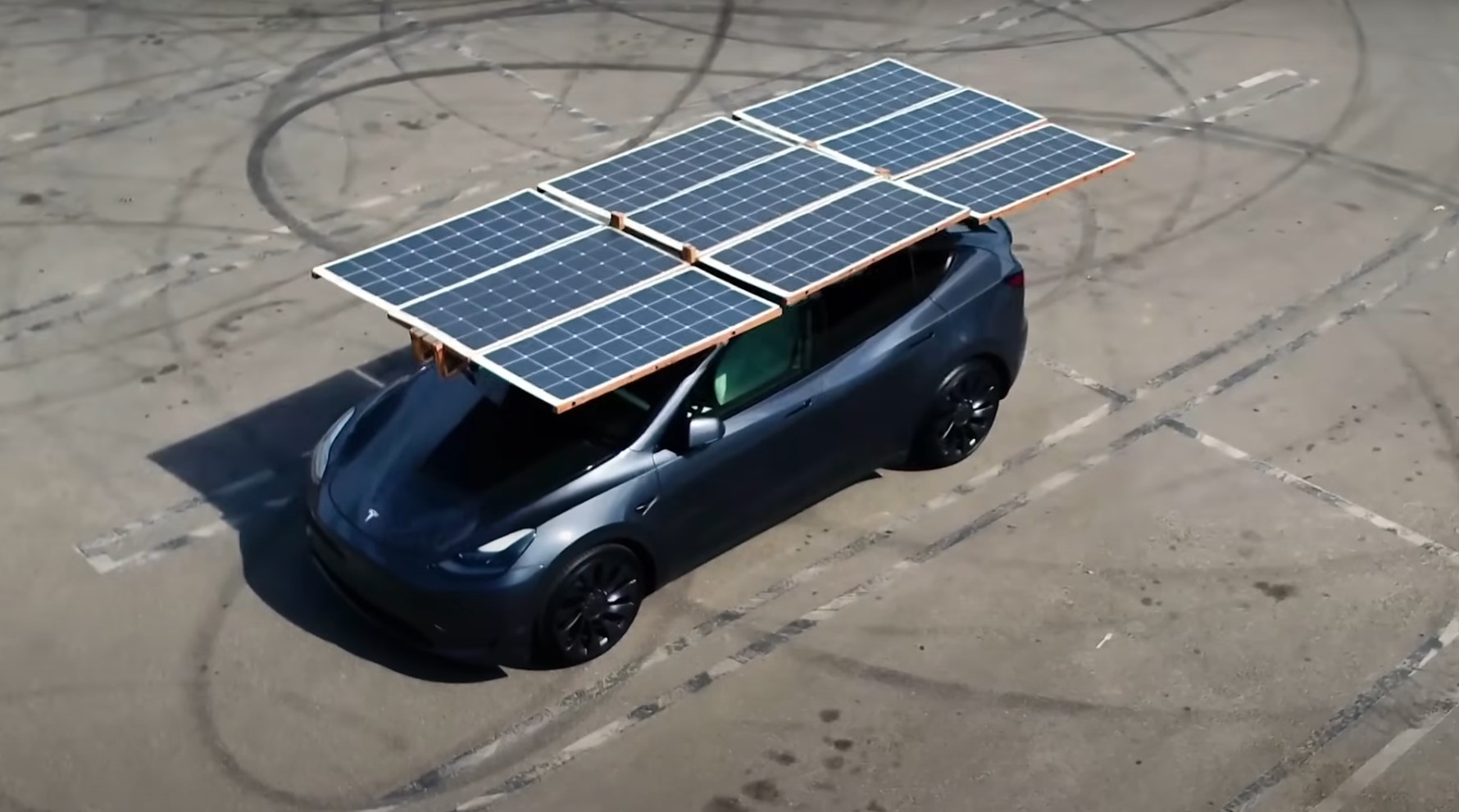 Collapsible solar array mounted on roof of Tesla