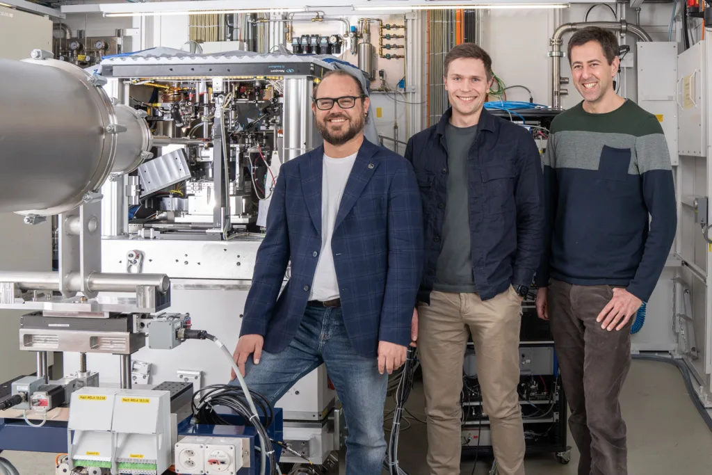 Manuel Guizar-Sicairos, Tomas Aidukas and Mirko Holler (from left to right) standing in front of their experimental apparatus at the Swiss Light Source SLS at PSI. The research scientists used the X-rays produced here to set a new world record. © Paul Scherrer Institute PSI/Mahir Dzambegovic